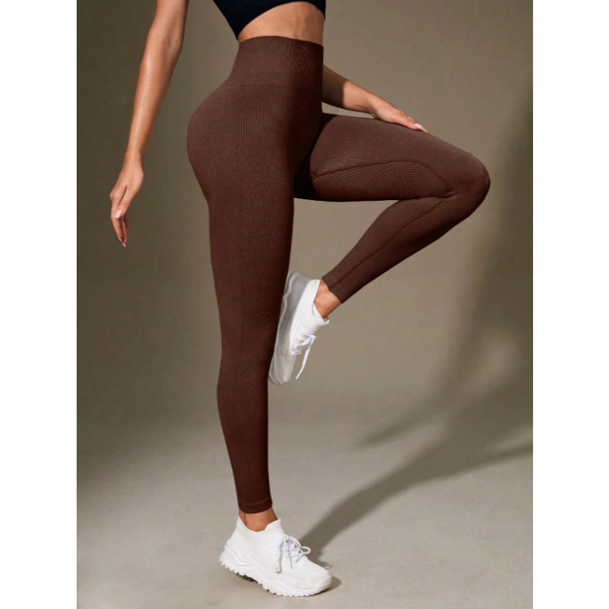Leggings canelada de cintura larga e cor sólida para atividades esportivas.