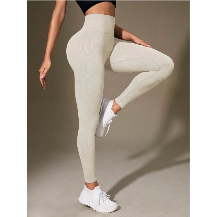 Leggings canelada de cintura larga e cor sólida para atividades esportivas.